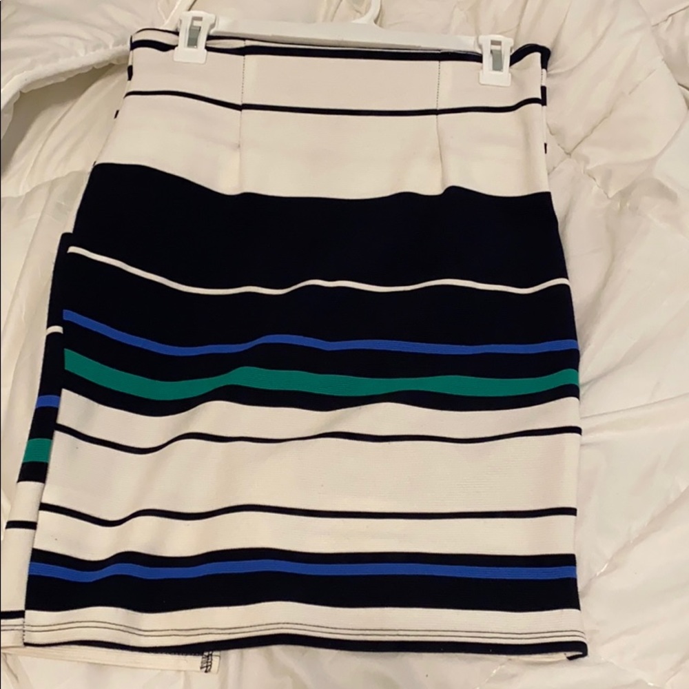 Black, white, blue, and green shirt